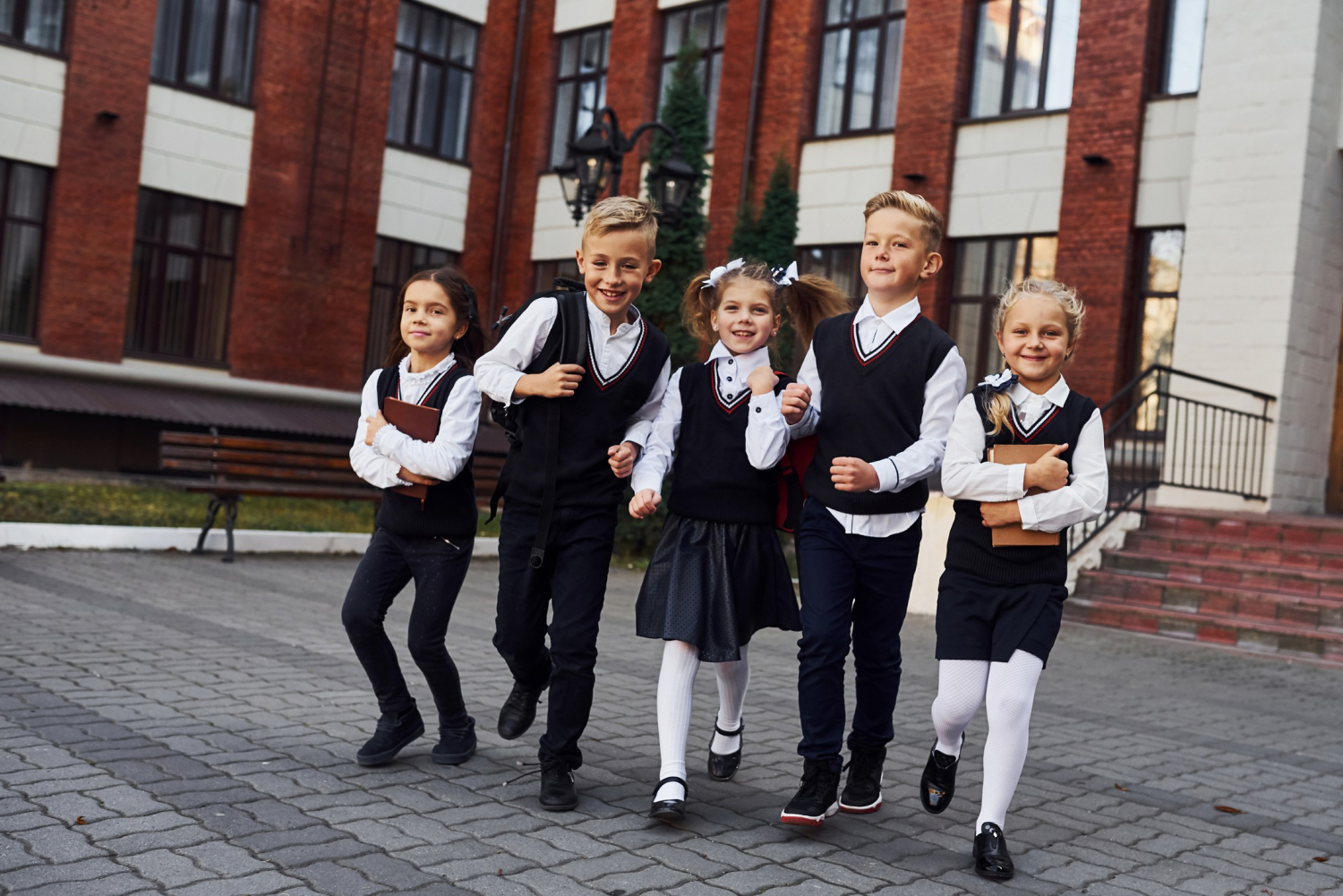 group-kids-school-uniform-posing-camera-outdoors-together-near-education-building
